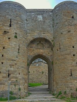 Big stone round towers and gate at Dinan fortress, France