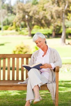 Retired woman reading a book