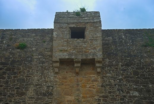 Part of fortress defensive wall with small tower in the middle