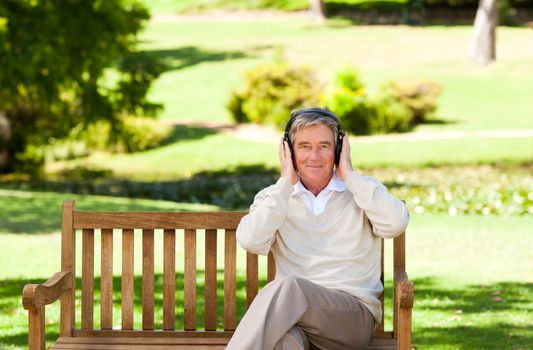 Retired man listening to some music during the summer