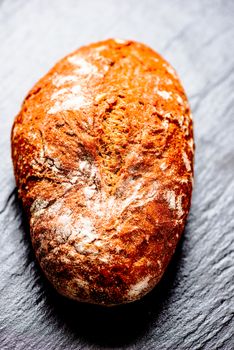 Bread loaf on stone surface