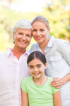 Adorable family in the park during the summer 