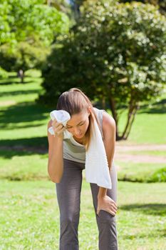 Sporty woman in the park during the summer