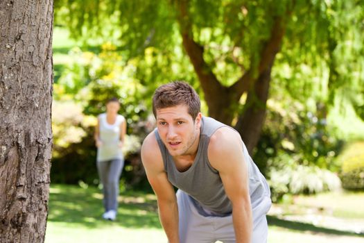 Tired couple in the park during the summer