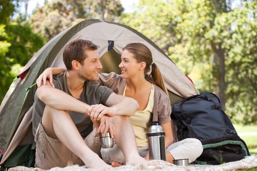 Couple camping in the park during the summer