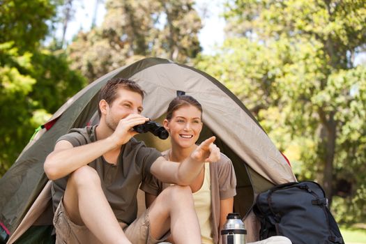 Couple camping in the park during the summer