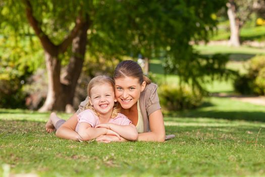 Daughter with her mother in the park during the summer