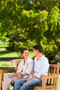 Couple on the bench during the summer