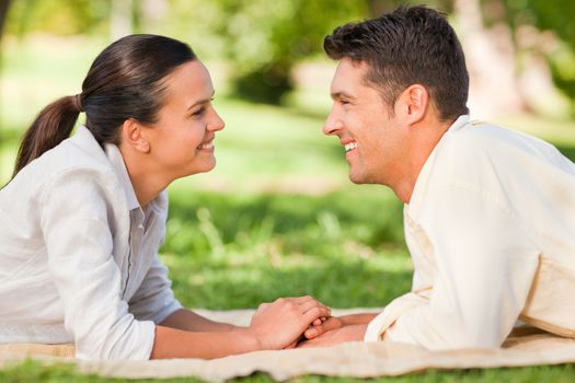 Enamored couple in the park during the summer