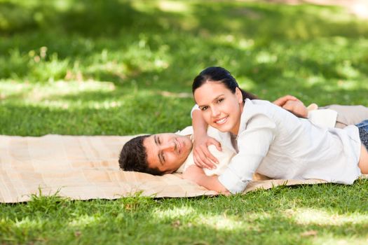 Beautiful woman with her husband in a park
