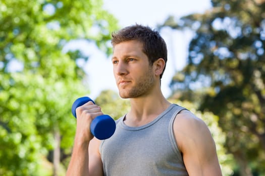 Man doing his exercises in the park during the summer