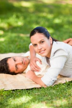 Beautiful woman with her husband in a park