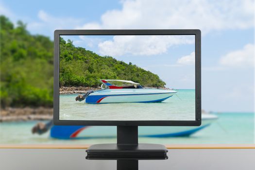 See Speed Boat at Sai Kaew Beach in Thailand through office PC monitor