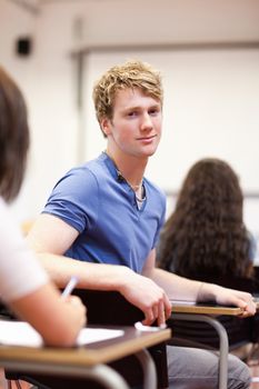 Portrait of a student sitting in a classroom