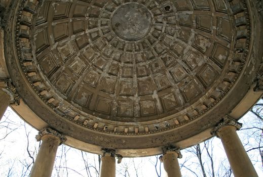 The texture of the roof of an old stone gazebo in antique style in the park