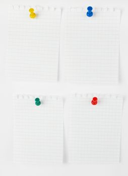 collection of note papers with push pins on white background. each one is shot separately 