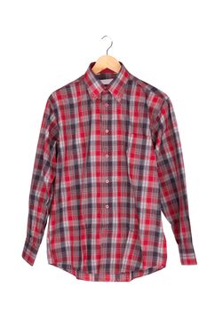 Red checkered shirt on wooden hanger  isolated on white 