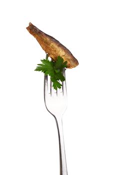 Smoked sprats on fork isolated on a white