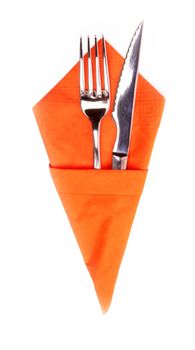 knife and fork on a napkin on the white