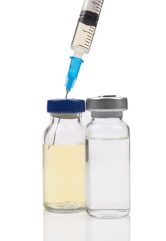 Ampules and syringe isolated on white background 