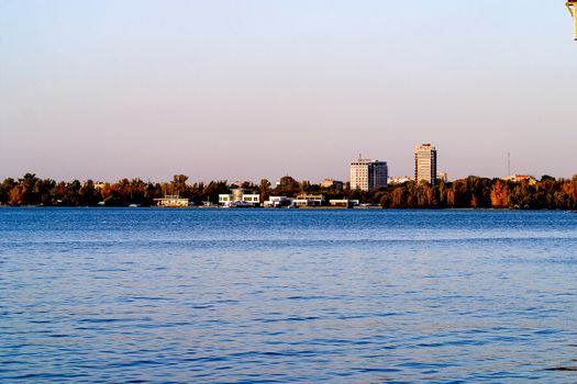 Left side of Dnipro city, Ukraine. Panoramic view of Dnipro river. Cityscape Housing estate Sunny with buildings.