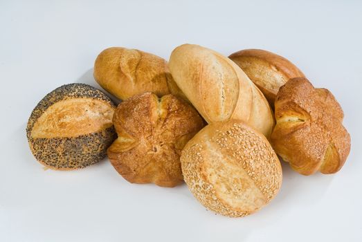 Different kinds of pastry on an isolated studio background
