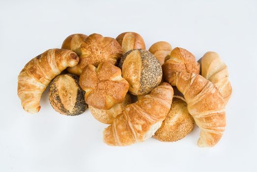 Different kinds of pastry on an isolated studio background