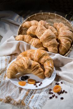 Different kinds of bread and pastry on a canvas studio background