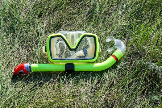 underwater mask and snorkel  lying on the grass. diver equipment for diving