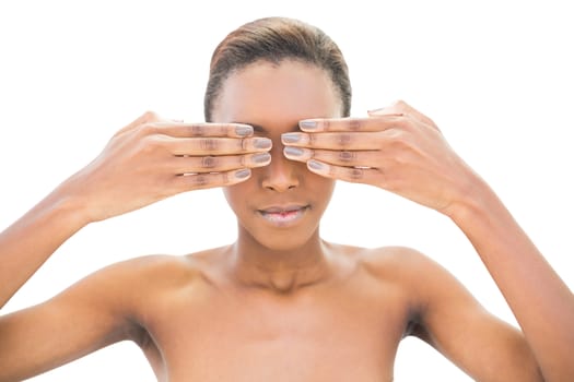 Natural beauty covering her eyes on white background