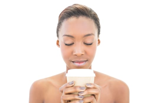 Natural beauty with closed eyes and coffee cup on white background