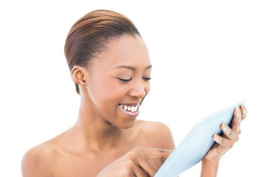 Smiling natural beauty with tablet computer on white background