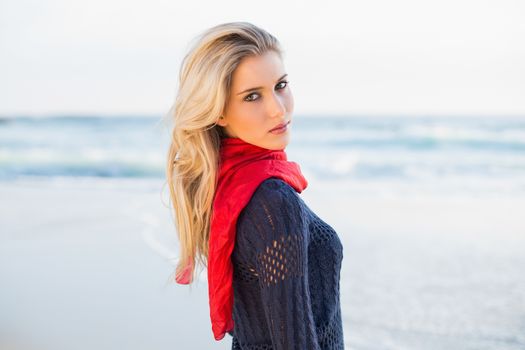 Attractive sexy blonde posing outdoors on a beautiful wild beach