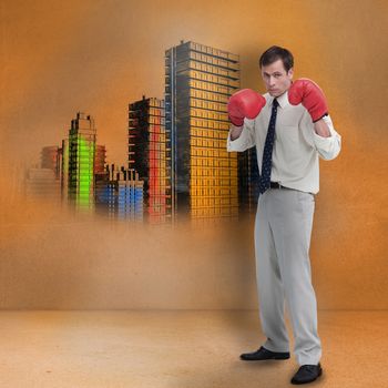Businessman with boxing gloves standing in front of colored city in brown room