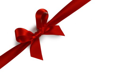 Red satin ribbon bow isolated on white background