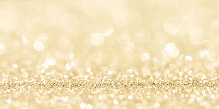 Shiny golden bokeh glitter lights abstract background, Christmas New Year party celebration concept