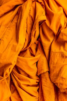 Yellow robe of Buddhist monks, Closeup on buddhist monk