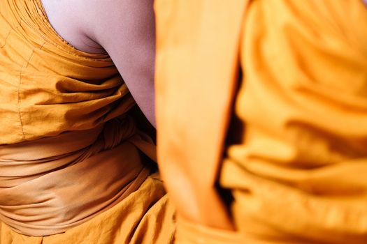 Yellow robe of Buddhist monks, Closeup on buddhist monk