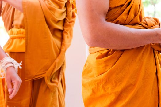 Yellow robe of Buddhist monks, Closeup on buddhist monk