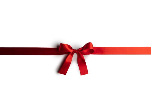 Red satin ribbon bow isolated on white background