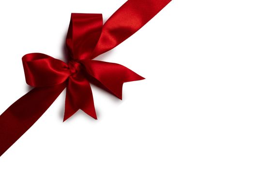 Red satin ribbon bow isolated on white background