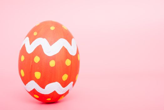 Beautiful Easter Red egg color on pink background, Easter day concept