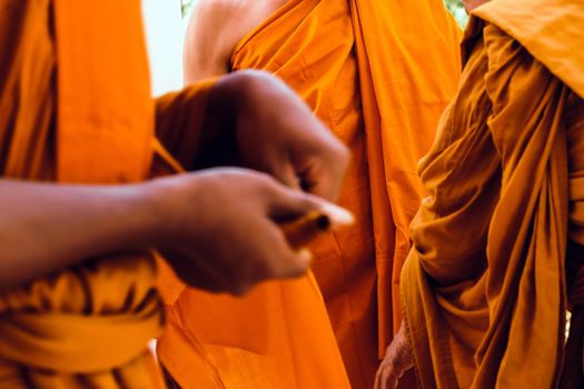 Yellow robe of Buddhist monks, Closeup on buddhist monk
