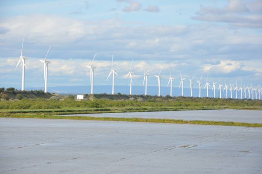 landscape filled with wind turbine in the Camargue, France. new energies