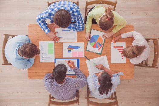 Group of multiethnic busy people working in an office, top view