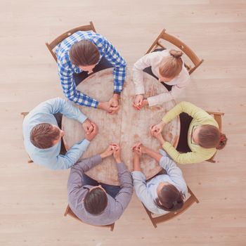 Hipster business teamwork brainstorming planning meeting concept, people team sitting around round table