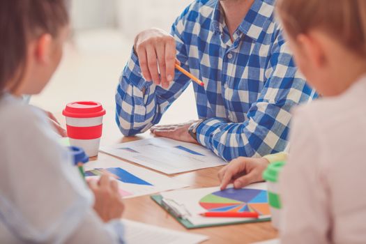 Group of multiethnic busy people working in an office, close up view