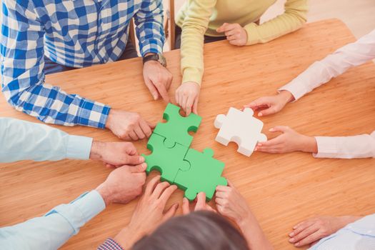 Hipster business successful teamwork concept, business people group assembling jigsaw puzzle