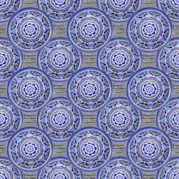 Seamless background from a set of decorative ceramic dishes hand-painted with acrylic paints with a floral pattern.
