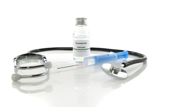 Coronavirus vaccine vial with injection syringe and stethoscope isolated on white background